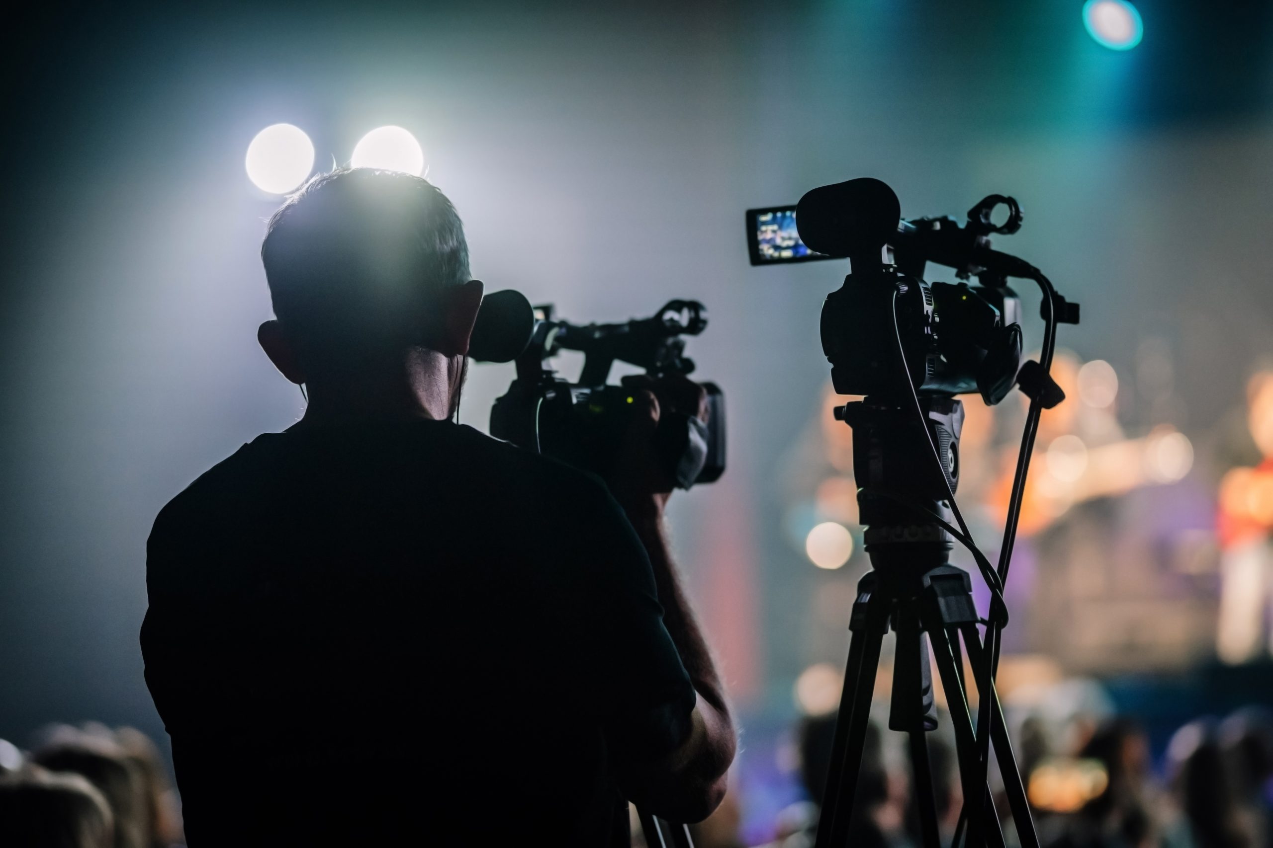 Professional,Digital,Video,Camera,Technician.,Videographer,With,Equipment,At,Event.